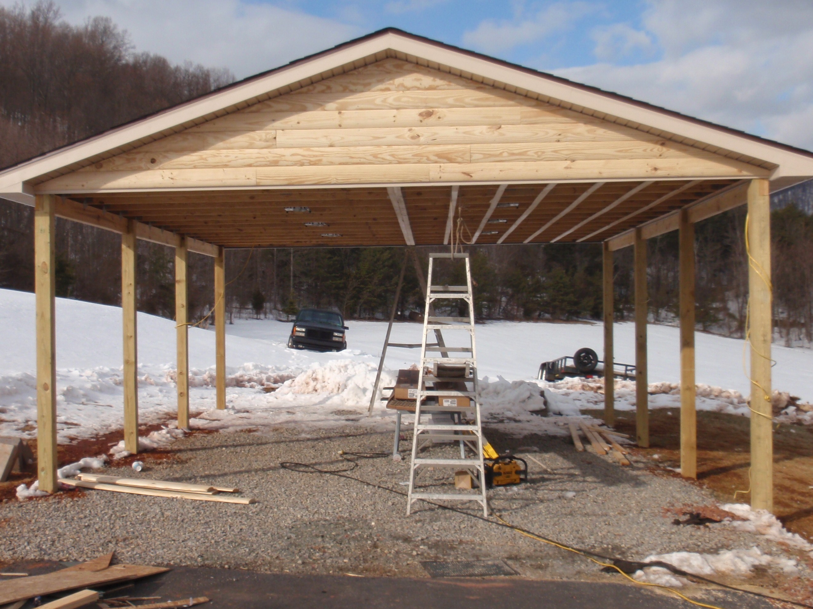 Double D Contracting : Log siding carport to match home.